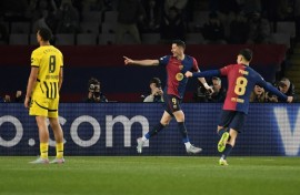 Barcelona's Polish forward Robert Lewandowski (C) celebrates scoring his team's second goal in the rout of Dortmund