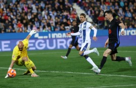 Leganes' Serbian goalkeeper Marko Dmitrovic (L) can't keep out Jorge Saenz's own goal