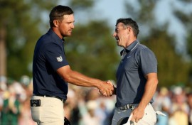 Rory McIlroy shakes hands with playing partner Bryson DeChambeau at the final hole of regulation at the Masters, where he triumphed in a playoff over Justin Rose
