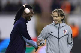 Real Madrid and Croatia midfielder Luka Modric (right) has bought a stake in Championship club Swansea