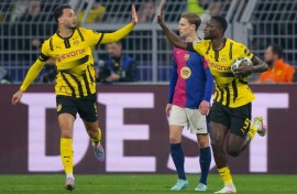 Serhou Guirassy (R) scored a hat-trick but was unable to help his side come back against Barcelona