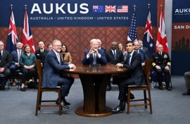Former US president Joe Biden (C) participates in a 2023 AUKUS summit with then-British PM Rishi Sunak (R) and Australia's Anthony Albanese (L)