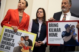 US lawmakers Nydia Velazquez (L) and Juan Vargas (R) hold signs with pictures of Kilmar Abrego Garcia, a migrant and US resident wrongly deported to El Salvador