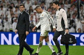 Kylian Mbappe hobbles of the pitch during REal Madrid's Champions League quarter final tie with Arsenal at the Santiago Bernabeu