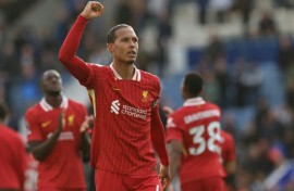 Liverpool's Virgil van Dijk celebrates winning the Premier League title