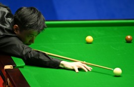 China's Zhao Xintong plays a shot at the World Snooker Championship in 2022