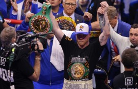 Mexico's Canelo Alvarez celebrates after wunifying the super middleweight titles against Cuba's William Scull