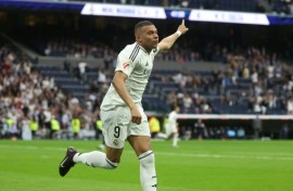 Real Madrid's French forward Kylian Mbappe celebrates after scoring his second against Celta Vigo