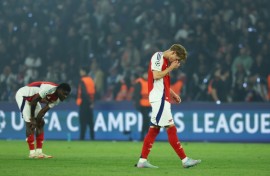 Arsenal's players react after their Champions League defeat against Paris Saint-Germain