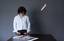 Iranian filmmaker and activist Sepideh Farsi looks at a portrait of the Palestinian photographer Fatima Hassouna, who was killed in the bombing of her house in the Gaza Strip