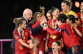 Gianni Infantino hands the 2023 Women's World Cup trophy to the Spanish team