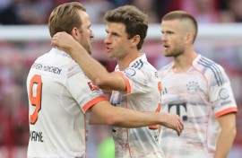 Bayern Munich's Harry Kane (L) farewells departing veteran Thomas Mueller (middle). Eric Dier (R) will also leave the club in the summer.