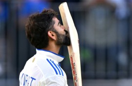 Virat Kohli celebrates reaching a century during the first Test against Australia in Perth in December 2024