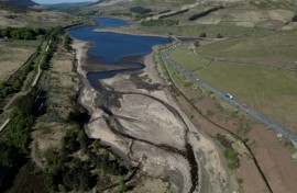 An aerial photo shows the bed of Woodhead Reservoir is partially revealed by falling water levels, near Glossop, northern England as the country experiences its driest start to spring in 69 years
