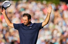 World number one Scottie Scheffler of the United States celebrates after winning the PGA Championship at Quail Hollow for his third major title