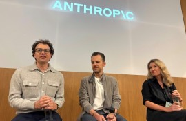 Anthropic CEO Dario Amodei (l) says people are going to eventually have to cope with AI systems being able to handle just about any task a human can handle