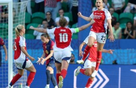 Arsenal's Swedish striker Stina Blackstenius celebrates with team-mates after netting in the women's Champions League final