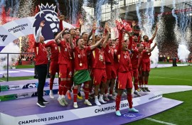 Liverpool's Virgil van Dijk lifts the Premier League trophy