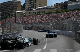 Traffic jam: Mercedes driver George Russell (L) grew frustrated when he was stuck behind the the slow-moving Williams cars on Sunday