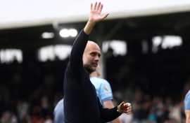 Manchester City manager Pep Guardiola waves to the crowd after his side's 2-0 win away to Fulham in their final game of the Premier League season