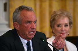 US Secretary of Health and Human Services Robert F. Kennedy Jr. (L) gestures as he speaks as US Secretary of Education Linda McMahon looks on during a MAHA (Make America Healthy Again) Commission Event in the White House