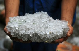 Hailstones covered the ground and battered seafront businesses during the storm in Egypt's Alexandria