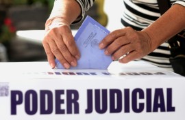 A woman casts her vote during elections making Mexico the world's only country to choose judges and magistrates at all levels through a popular vote