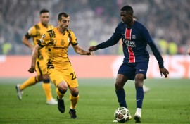 Ousmane Dembele screening the ball from Inter Milan's Henrikh Mkhitaryan