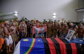 Xukuru's Indigenous people sing a sacred prayer in honor of the Brazilian Indigenous expert Bruno Pereira next to his coffin during his funeral after his murder in June 2022