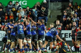 Auckland Blues players celebrate after beating the Waikato Chiefs