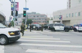 Police stand watch in Los Angeles after a weekend marked by protests