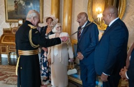 Former Rugby League player Billy Boston is knighted by Britain's King Charles III