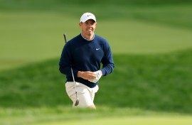 World number two Rory McIlroy of Northern Ireland walks to the 18th green during a practice round ahead of the 125th US Open at Oakmont