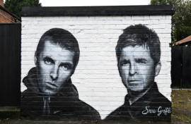 A mural by the artist known as Snow Graffiti of Liam and Noel Gallagher outside the Whitefield pub in Manchester, where they will play in July