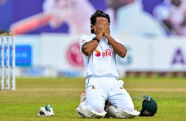 Bangladesh's captain Najmul Hossain Shanto celebrates after scoring a century during the fifth and final day of the first Test cricket match against Sri Lanka