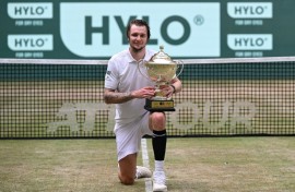 Kazakhstan's Alexander Bublik celebrates his second title on the grass of Halle, Germany