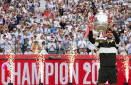 Spain's Carlos Alcaraz celebrates his second Queen's Club title before Wimbledon