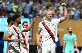 Manchester City striker Erling Haaland celebrates after tucking away his penalty