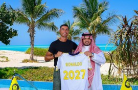 Cristiano Ronaldo (left) with Al Nassr's chairman Abdullah Al-Majid after signing a new deal