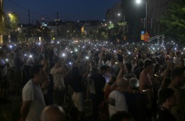 Protesters light up mobile phones as they demonstrate in front of the prosecutors offices calling for the release of their peers who were detained in protests the previous night