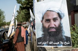 A poster of Taliban Supreme Leader Hibatullah Akhundzada along a road in Kabul