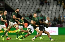 South Africa's Vincent Tshituka (L) tackles New Zealand's Jacob Ratumaitavuki-Kneepkens during the international rugby union match against the Barbarians in Cape Town