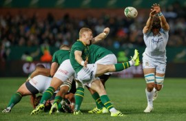 South Africa scrum-half Morne van den Berg (C) clears the ball against Italy in Pretoria