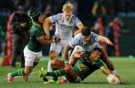 South Africa full-back Damian Willemse (R) under pressure from Italy centre Tommaso Menoncello (2nd R) in Pretoria.