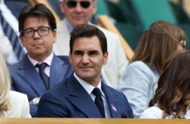 Roger Federer watching Novak Djokovic win from the royal box of Wimbledon's Centre Court