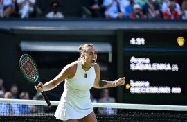 Aryna Sabalenka celebrates after beating Laura Siegemund at Wimbledon