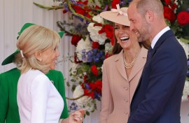 Dressed in a pale pink Dior jacket and dress ensemble, Catherine, Princess of Wales and her husband Prince William greeted the Macrons at an airbase west of London