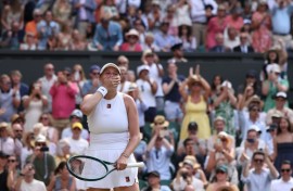 Amanda Anisimova celebrates reaching the Wimbledon final