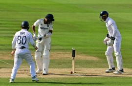 India's Mohammed Siraj (2L) can only watch as a ball from Shoaib Bashir spins back onto his stumps as Ollie Pope (L) and Jamie Smith (R) look on, as England win the third Test at Lord's by 22 runs
