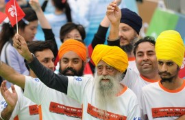 Fauja Singh (front), seen here after finishing a 10km race in Hong Kong in 2013, has died at the age of 114